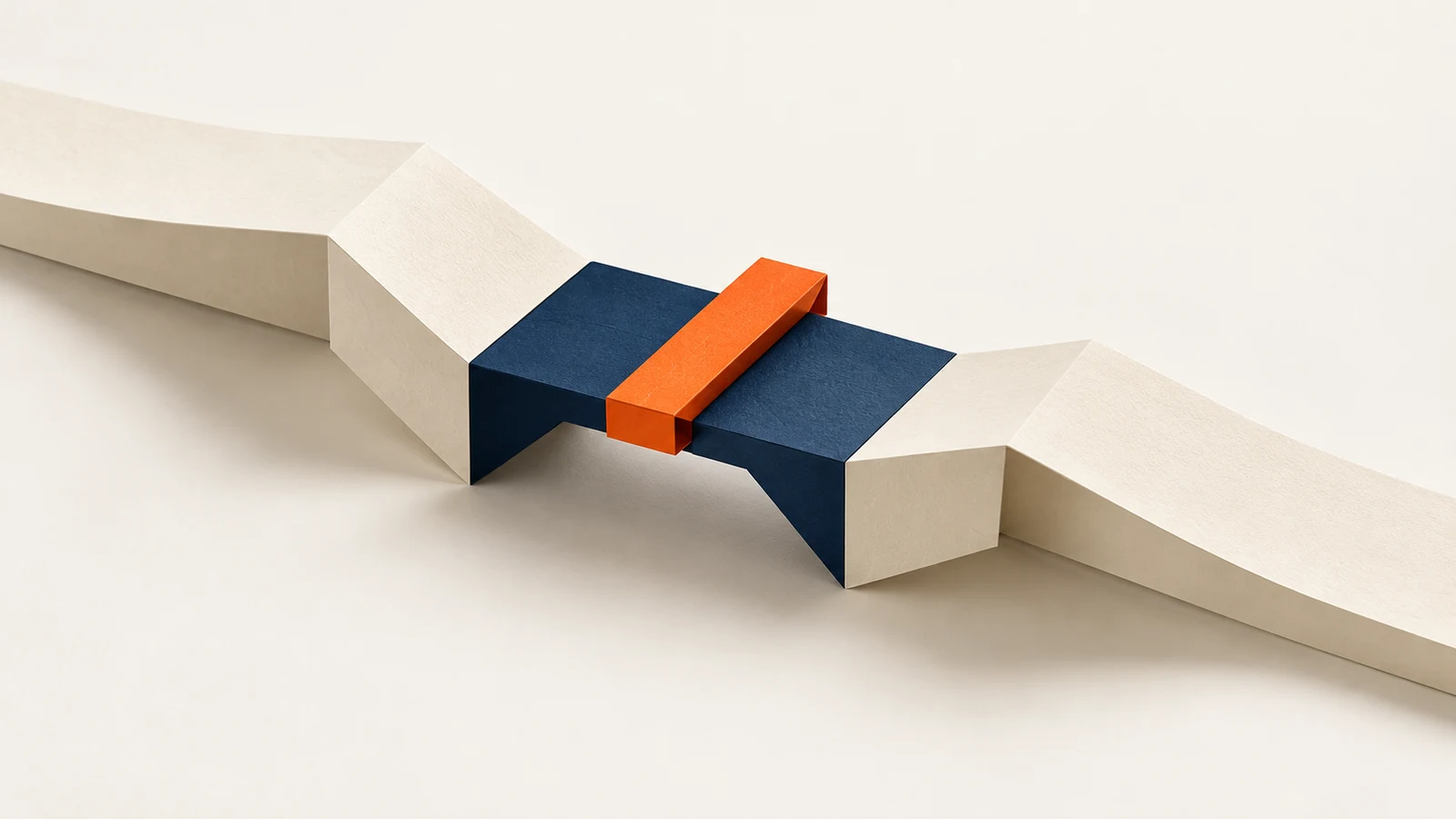 Two cream paper paths meet on a navy bridge, with an orange baton across the connection.